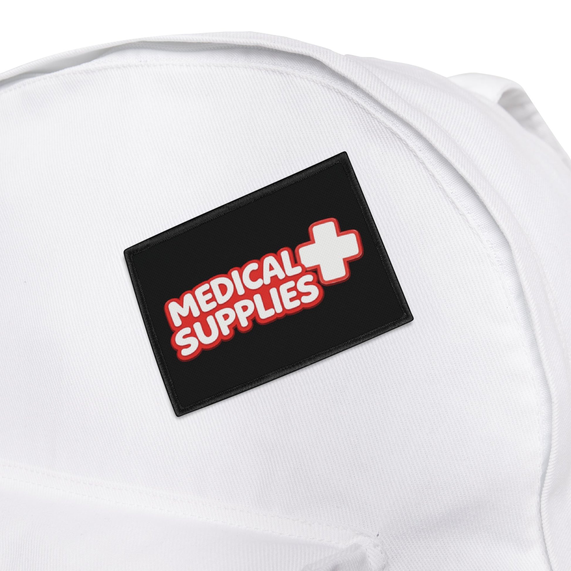 Black patch with 'Medical Supplies' text and a cross on a white background