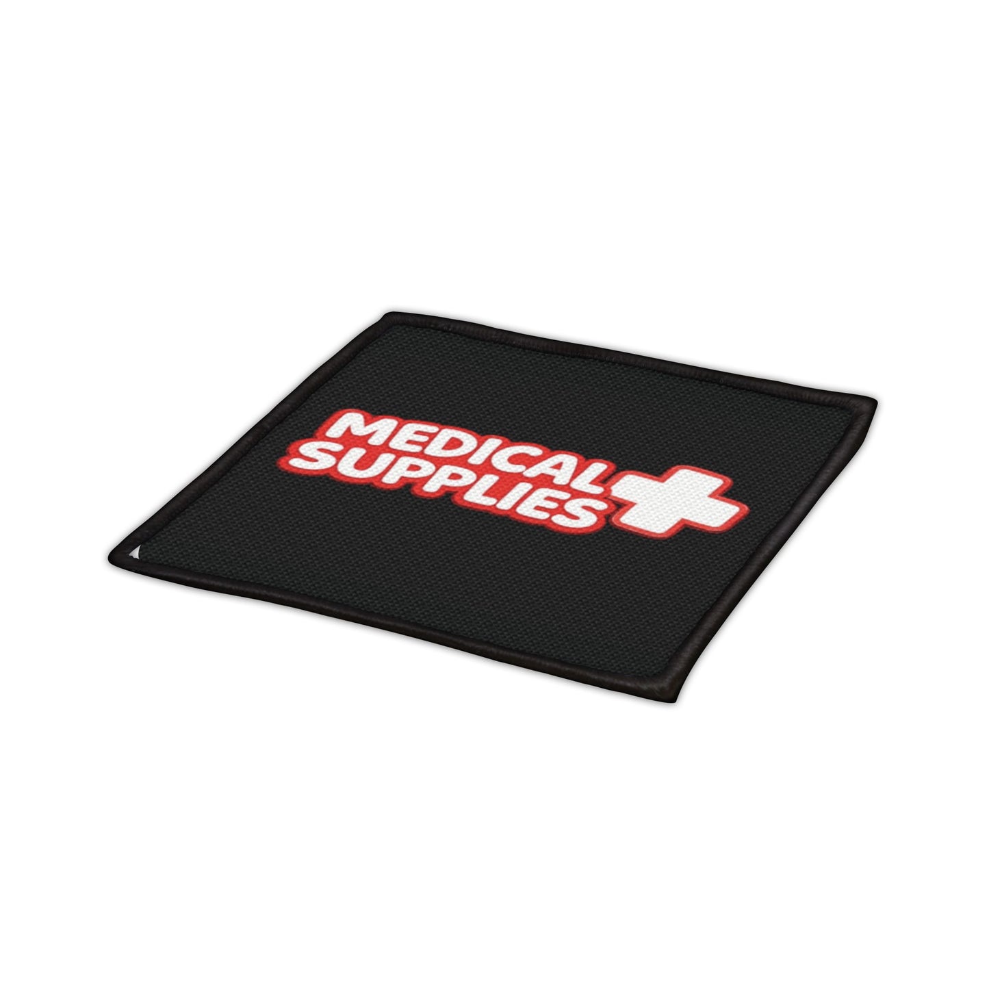 Black mat with 'Medical Supplies' text and a cross symbol on a white background