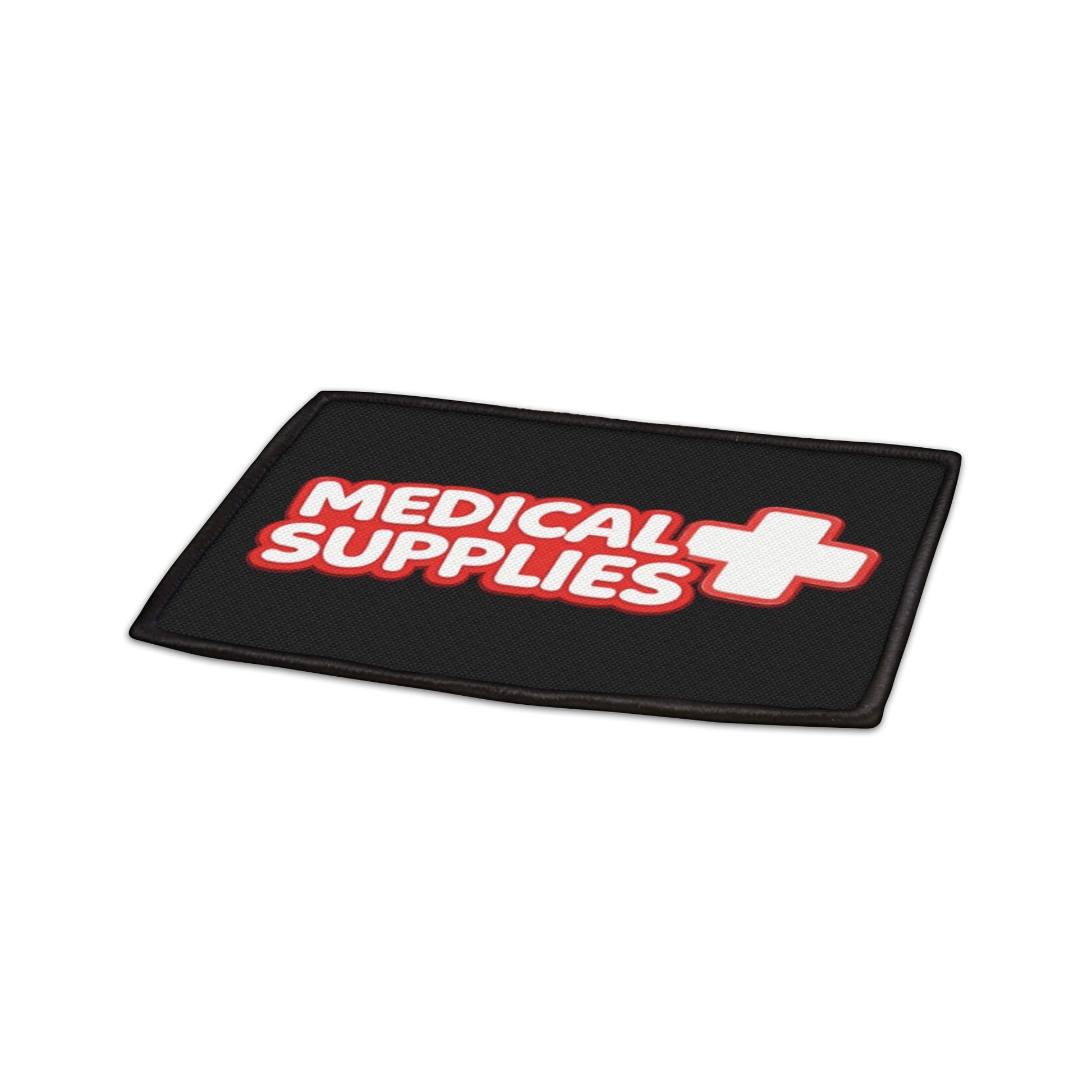 Black patch with 'Medical Supplies' text and red cross symbol on a white background